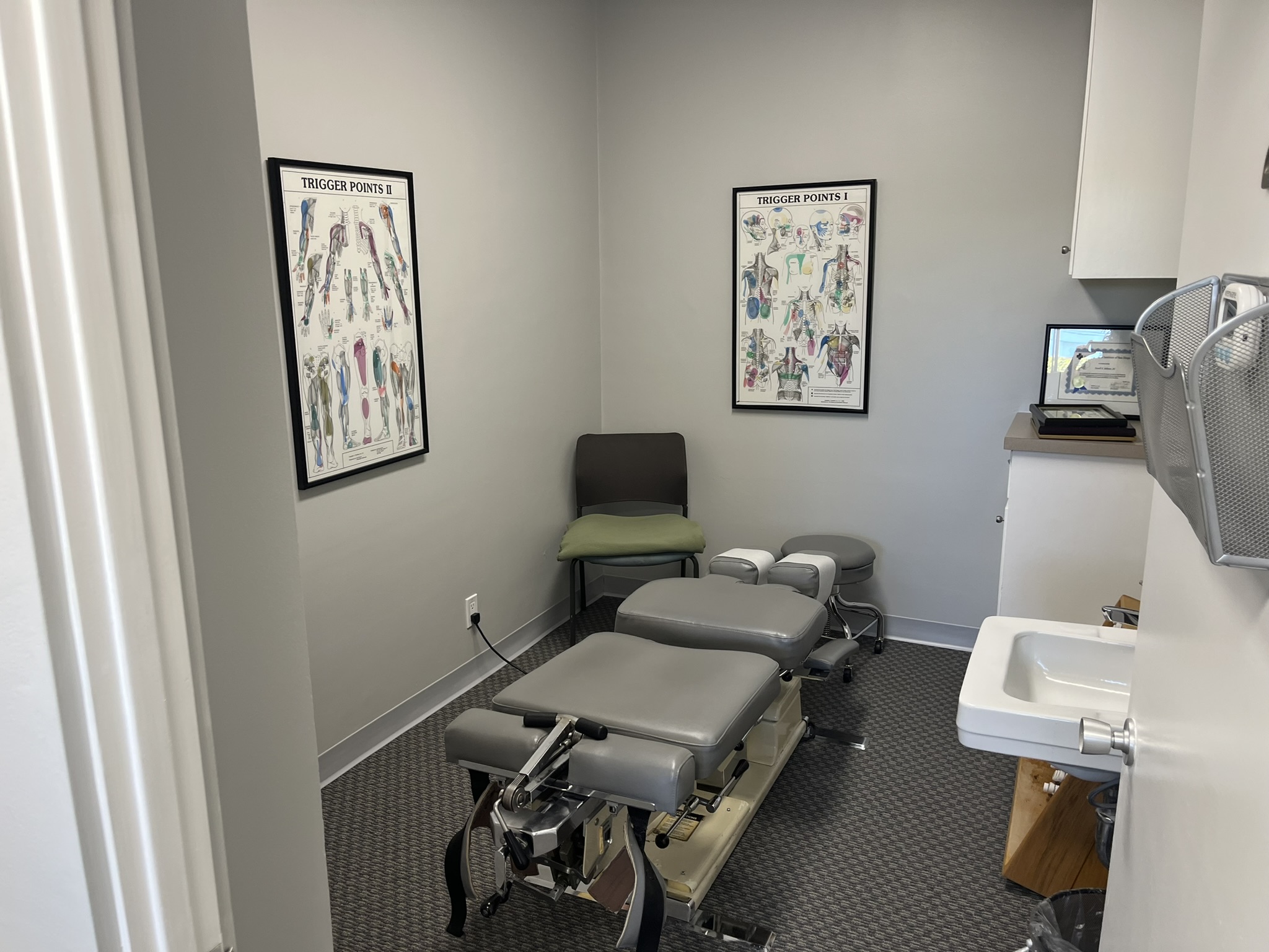 A physical therapy exam and treatment room at the Premier Body Method Sports Medicine and Chiropratic office.